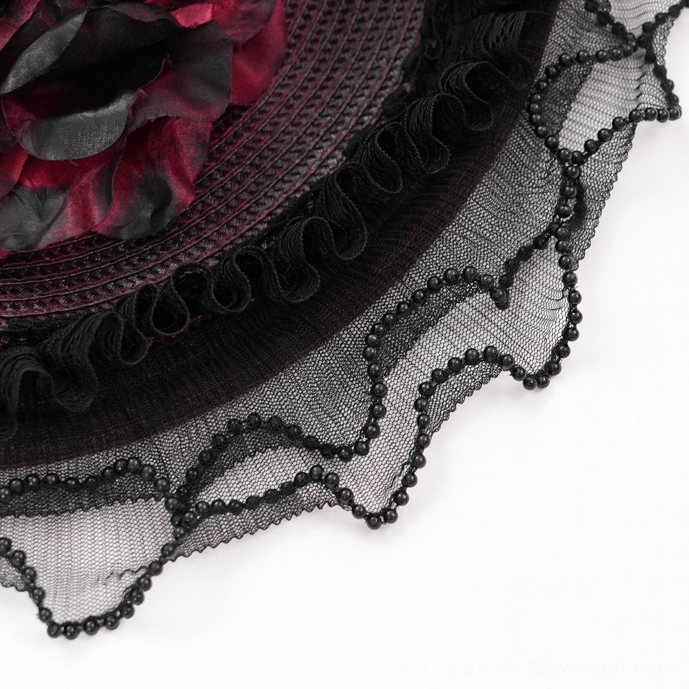 Alternative fashion styling example with burgundy black gothic fascinator paired with complementary dark clothing and accessories