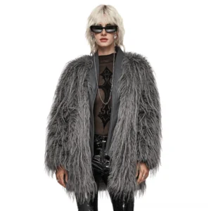 Asymmetrical grey faux fur gothic coat with textured leather lapels worn by blonde model, front view studio shot
