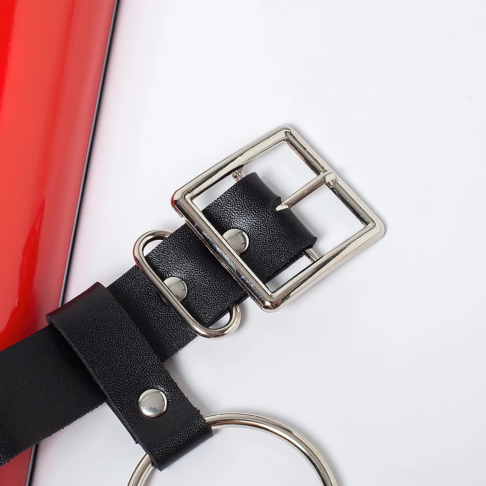 Product detail view of black gothic chain belt demonstrating chain attachment and metal ring construction quality