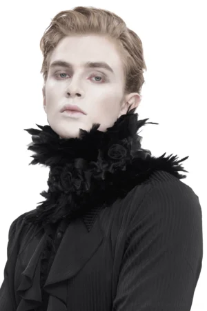 Black gothic feather choker with fabric flowers worn on male model in white studio setting, front view