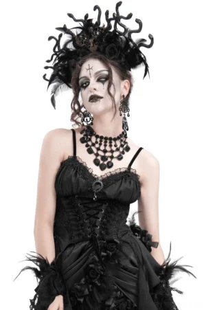 Black gothic feather corset top with front lace-up and embroidered rose details on model with gothic styling