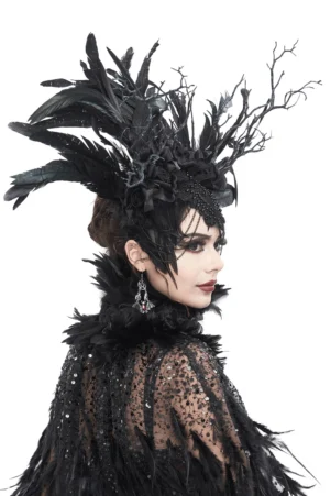 Black feather crown headdress rear view on gothic model, showing feather arrangement and branch accents, paired with dark cape