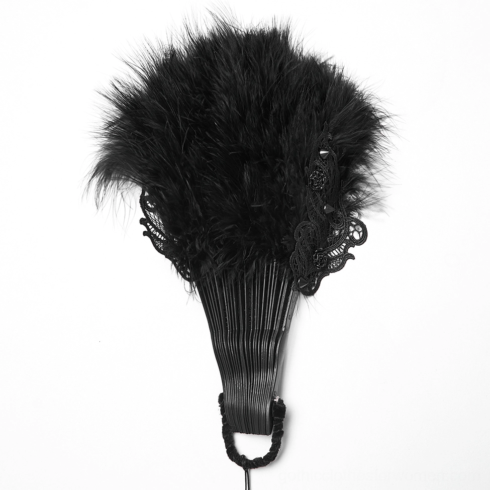 Side angle close-up of carved wooden frame and lace-trimmed edge of gothic black feather hand fan