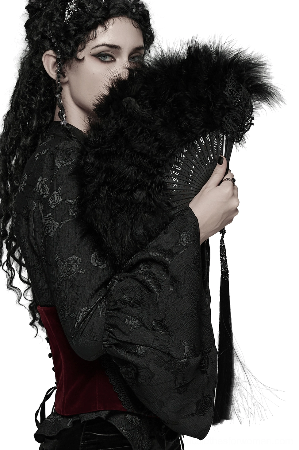 Gothic black feather hand fan with cross tassel pendant held by model in profile view, worn with dark embroidered corset