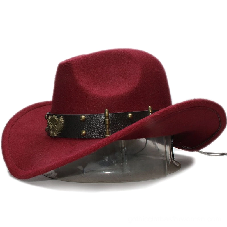 Gothic fedora hat leather band close-up showing eagle emblem and bullet studs detail