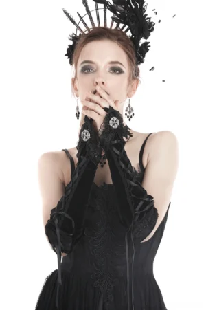 Gothic fingerless gloves with metal cross brooch and lace trim, modeled on female wearing feather crown in dark elegant styling