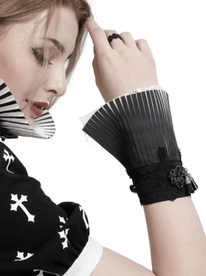 Close-up side view of gothic black and white lace fingerless gloves on hand, showing pleated cuff with white lace hem detail