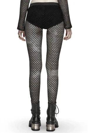 Black sheer mesh leggings rear full-body view showcasing fishnet texture and high-waisted design, paired with platform boots