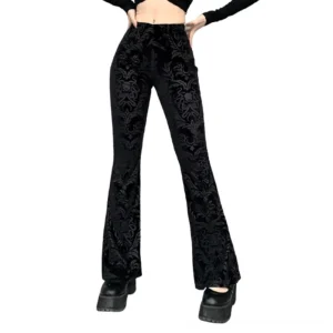 Women's high-waist black velvet gothic flared pants with baroque floral print, front full-body view on model against white background