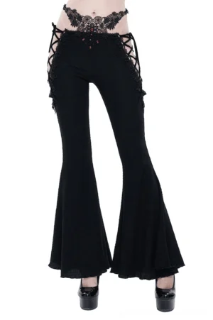 Gothic flared black trousers front view with red gemstone embellishments and lace cutout details