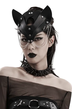 Black faux leather fox mask with silver chains and metal studs worn by goth model, front close-up studio headshot
