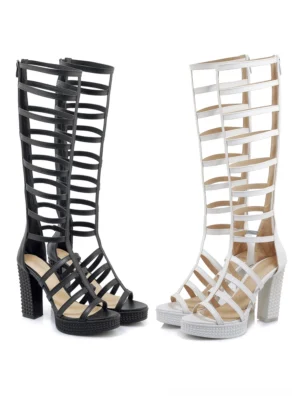 Black and white knee-high gladiator block heel sandals front view comparison showing both color options with geometric cutout straps