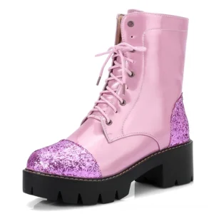 Pink patent leather gothic combat boots with purple glitter accents, lace-up design, and chunky platform sole - front side view