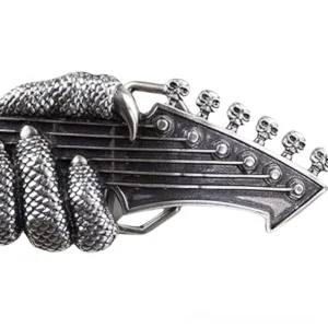Close-up detail of vintage silver dragon claw guitar head buckle with intricate texture and gothic skull design, side angle