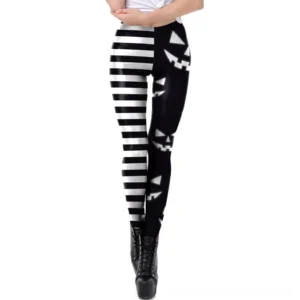 Women's gothic Halloween leggings with asymmetrical print design, front view showing pumpkin and stripe pattern detail