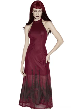 Front view of burgundy mesh halter maxi dress with gothic church print, worn by model with burgundy hair against studio background, showing full silhouette and ecclesiastical skirt design