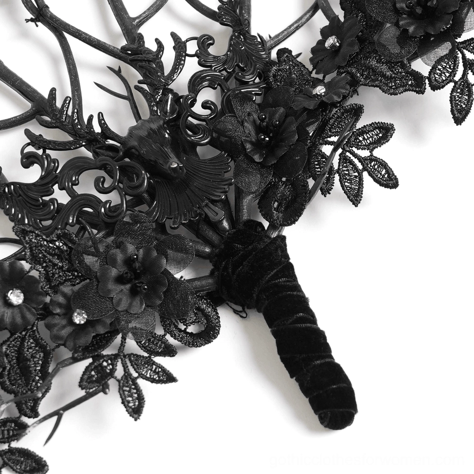 Detailed close-up of gothic fan hardware, velvet handle, fabric flowers with rhinestones, and ornate metallic carvings