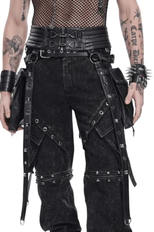 Black gothic utility harness belt with metal buckles and garter straps worn by tattooed model - front three-quarter view