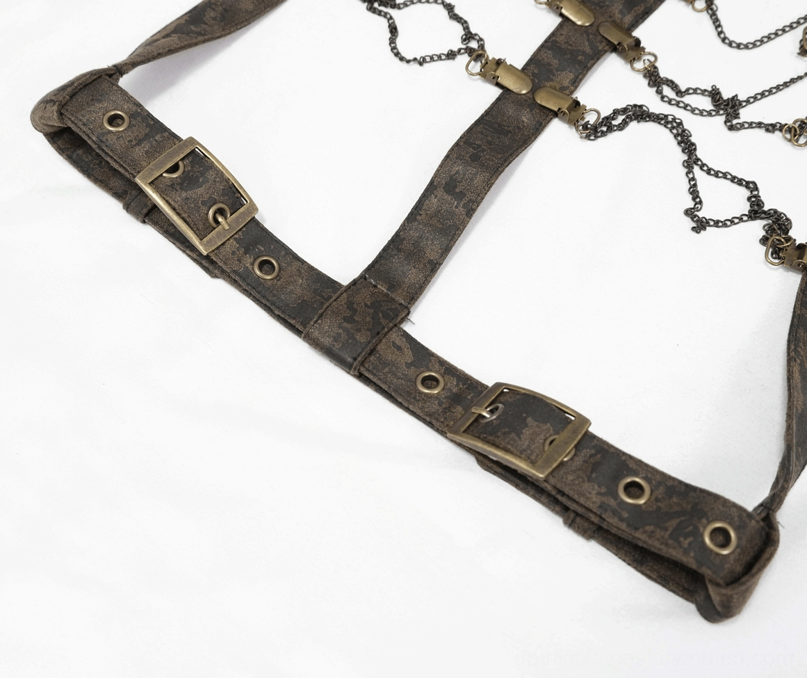 Detailed flat lay of harness strap components showing adjustable buckles and attached metal chains on faux leather