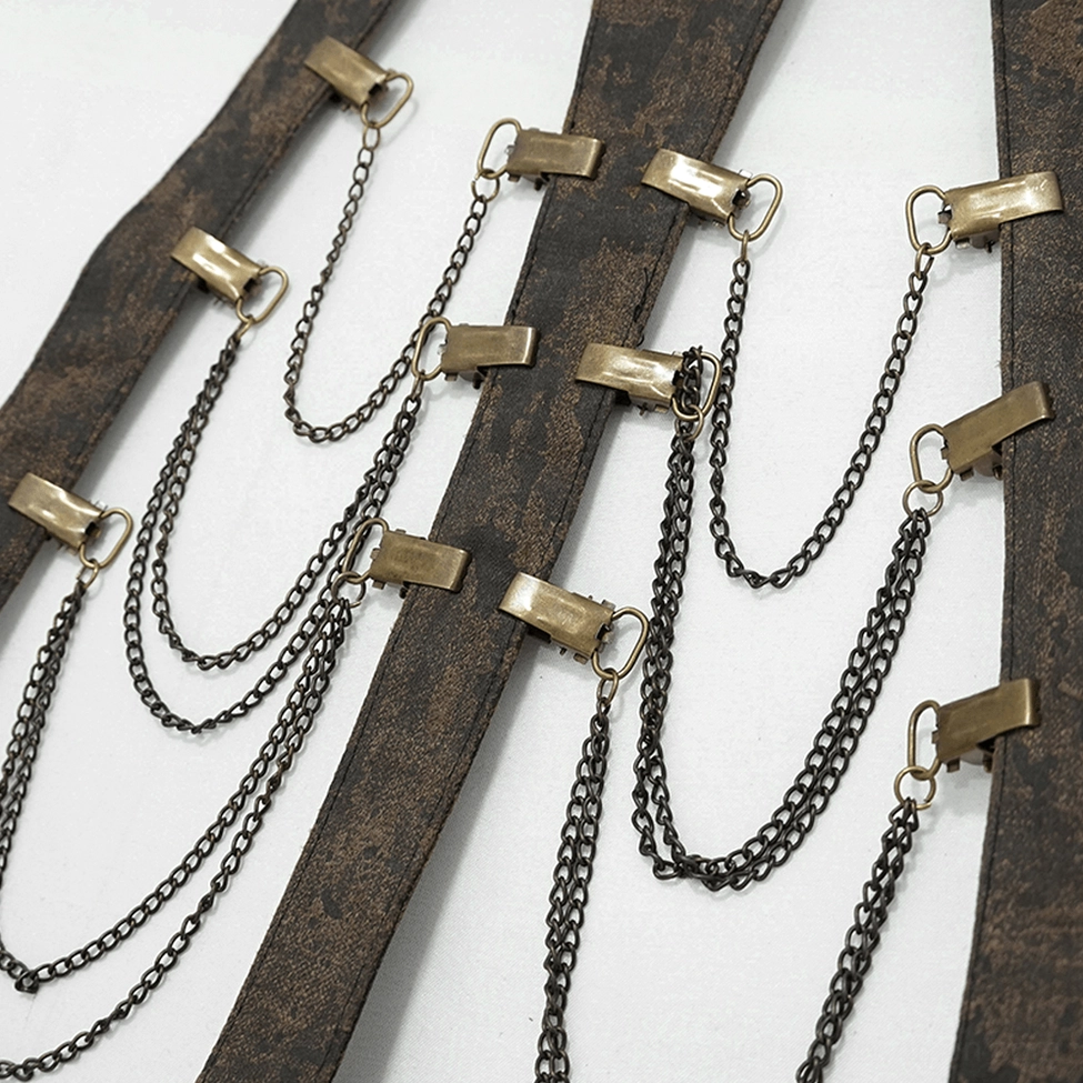 Close-up flat lay of layered metal chains and bronze fasteners on distressed vintage leather base