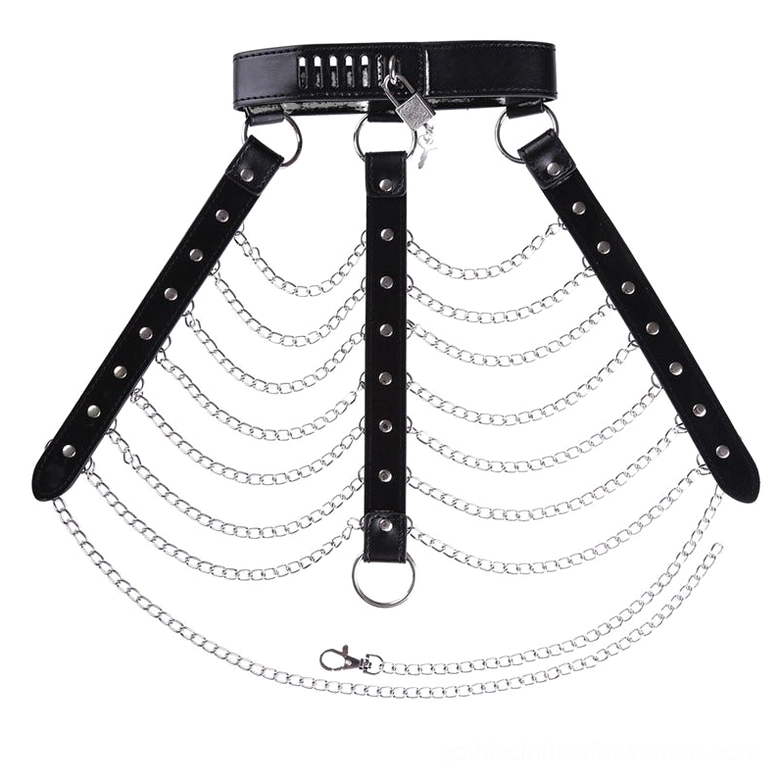 Flat lay arrangement of gothic harness components showing central buckle strap and adjustable neck strap detail