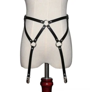 Gothic body harness displayed on dress form mannequin, full front view showing adjustable straps and silver cross hardware