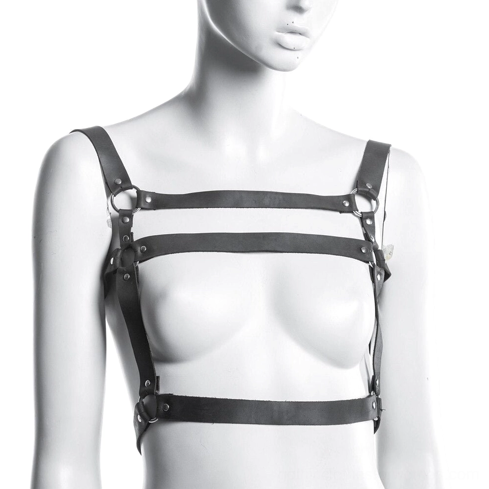Black leather harness with open chest cutout design worn on female mannequin, showing metal O-ring connectors