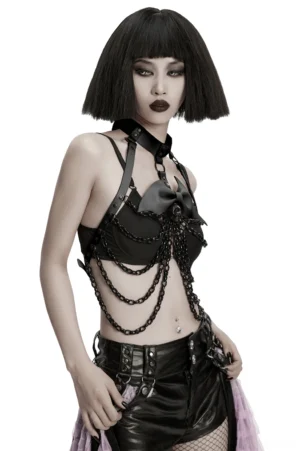Side three-quarter view of gothic chest harness on model, displaying bat-wing bow collar decoration and chain drape positioning