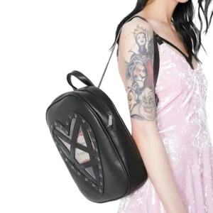 Black gothic heart transparent backpack with studded pentagram design, worn as side three-quarter view by model in pink velvet dress