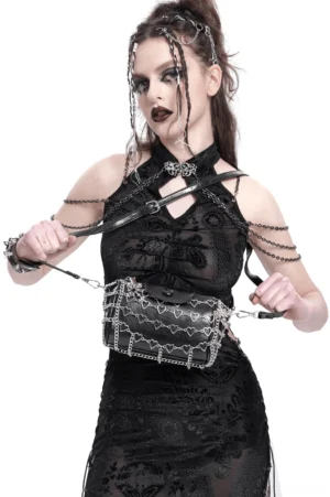 Gothic heart chain crossbody bag worn by model – front view showing silver heart embellishments on black leather