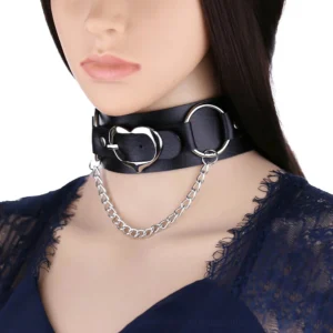 Black PU leather gothic choker with silver heart pendant and chain displayed on female mannequin, front close-up view