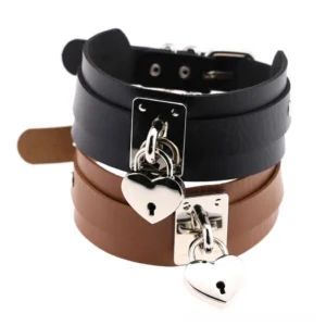 Stacked gothic choker necklaces in black and tan brown with silver heart lock charms - layered styling inspiration