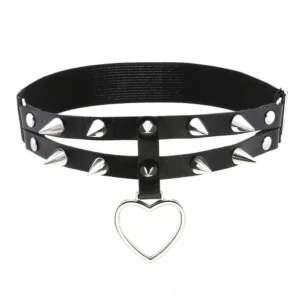 Gothic spiked heart charm pendant necklace with rivets, flat lay detail shot showing silver spikes and dangle heart charm