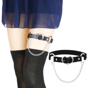 Gothic heart thigh harness with silver chain worn on female model, side view showcasing black PU leather strap and metal heart buckle detail