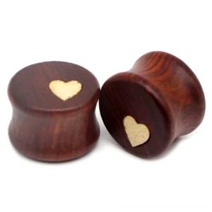 Handcrafted wooden ear tunnel stretchers featuring gothic heart inlay detail, brown natural wood with contrasting light heart accent