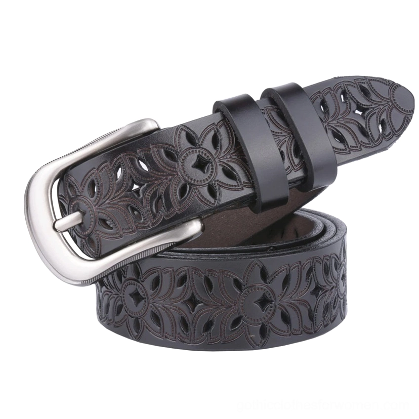Dark brown genuine leather hollow-carved gothic belt with large silver pin buckle, three-quarter top angle showing carved floral details