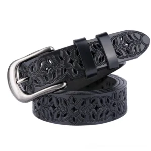Black genuine leather hollow-carved floral gothic belt with silver pin buckle, three-quarter view showing intricate carved pattern details