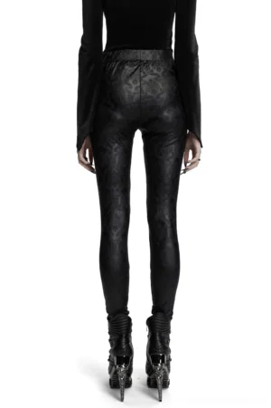 Gothic hollow out leggings with embossed paisley pattern, back view on model showing high-waisted silhouette