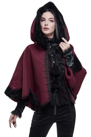 Red gothic hooded cape front three-quarter view on female model with black fur trim and pom-pom closures