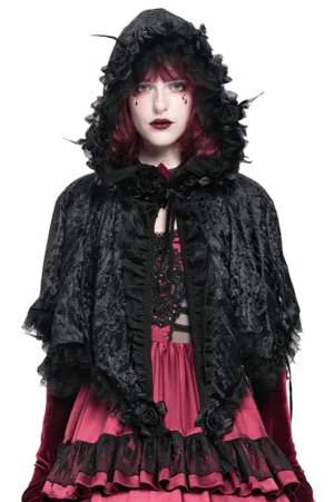 Black velvet Gothic hooded cape with rose lace trim, front view on model with red hair against studio background