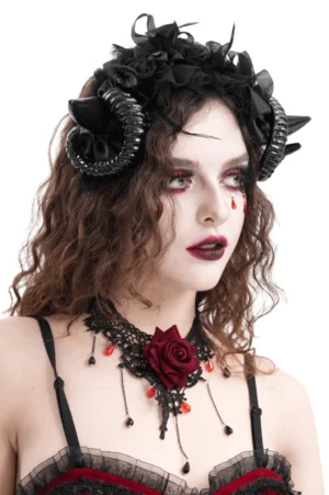 Dark gothic horn headband featuring spiral black horns and red rose choker detail, right three-quarter profile view on model
