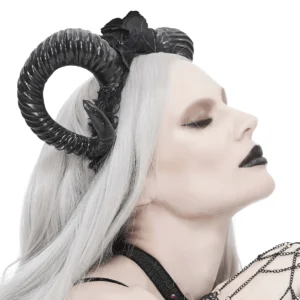 Side profile view of black gothic horn headdress with lace trim, embroidered roses, and chain hand accessory on model
