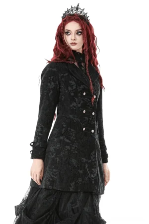 Gothic black jacquard long coat side profile on model – demonstrating structured shoulders, sleeve detail, and flared hem elegance