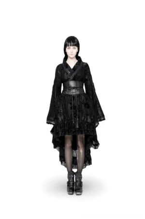 Black gothic flocked lace kimono maxi dress front view, worn by model on white studio background, showing asymmetric hem and waist sash detail
