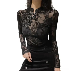 Black gothic lace blouse with floral embroidery front view on model, sheer mesh fabric with velvet frog button closure and stand collar