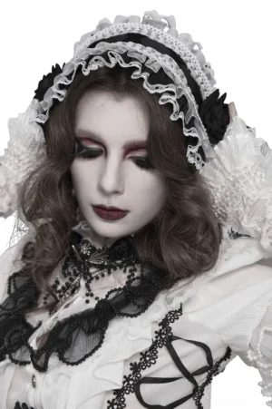 Front close-up view of gothic lace bonnet with vintage lace veil details and sheer ruffles