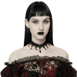 Black gothic lace choker with coffin beads and dangling chain pendants worn on model chest