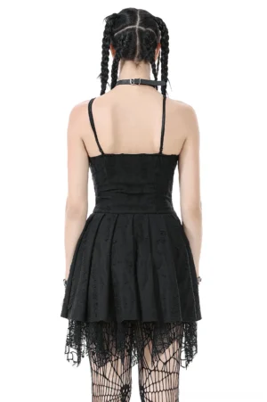 Black gothic lace corset mini dress back view showing pleated skirt and spaghetti straps with fishnet stockings