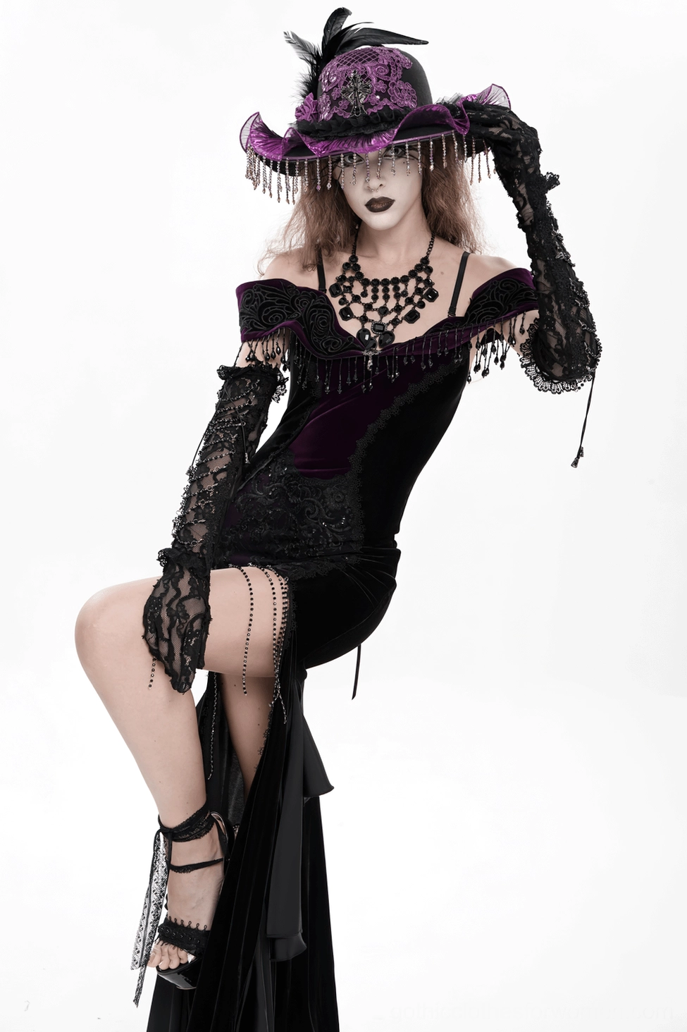 Lace fingerless gothic gloves close-up showing transparent lace pattern and chain details