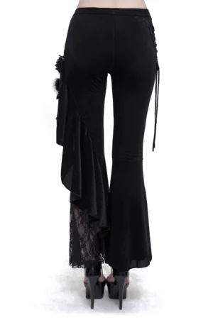 Back view of gothic lace flared pants on model, displaying asymmetrical ruffle trim and lace hem panel design
